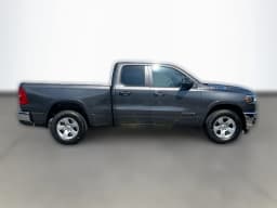 Ram 1500 Big Horn 4x2 Quad Cab 6'4" Box 2026 — side view