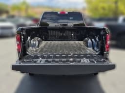 Ram 1500 Big Horn 4x2 Quad Cab 6'4" Box 2026 — side view