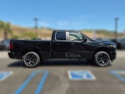 Ram 1500 Big Horn 4x4 Quad Cab 6'4" Box 2026 — side view
