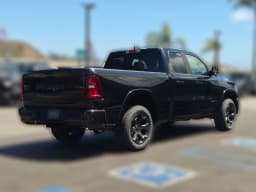 Ram 1500 Big Horn 4x4 Quad Cab 6'4" Box 2026 — side view