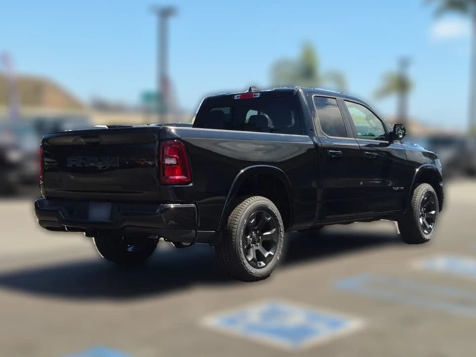 Ram 1500 Big Horn 4x4 Quad Cab 6'4" Box 2026 — side view