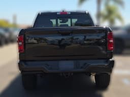 Ram 1500 Big Horn 4x4 Quad Cab 6'4" Box 2026 — side view