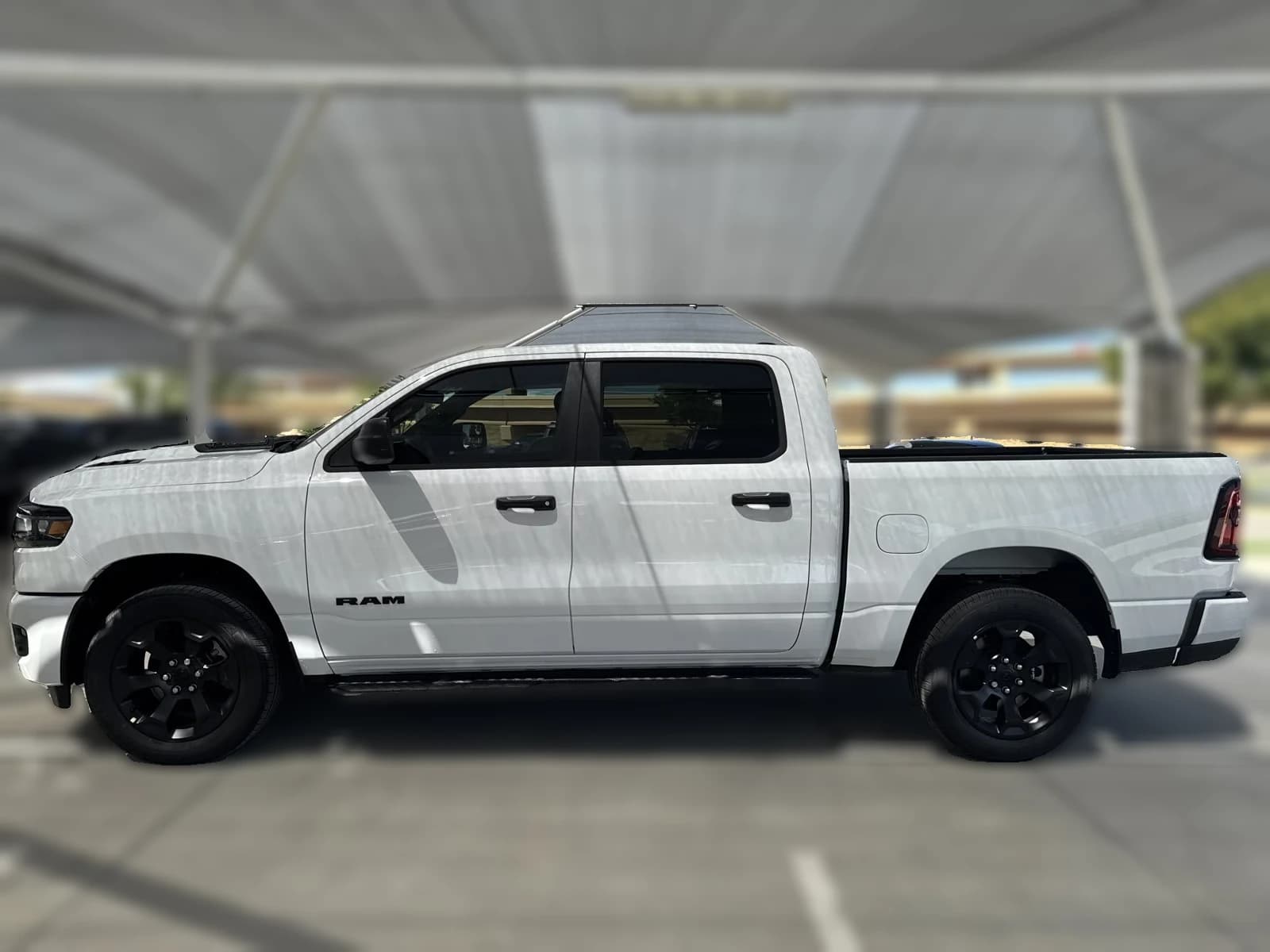 Ram 1500 Express 4x4 Crew Cab 5'7" Box 2026 — side view