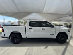 Ram 1500 Express 4x4 Crew Cab 5'7" Box 2026 — side view