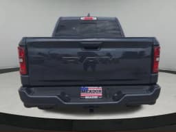Ram 1500 Express 4x4 Crew Cab 5'7" Box 2026 — side view