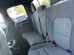 Ram 1500 Big Horn 4x4 Quad Cab 6'4" Box 2026 — side view