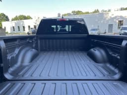 Ram 1500 Big Horn 4x4 Quad Cab 6'4" Box 2026 — side view