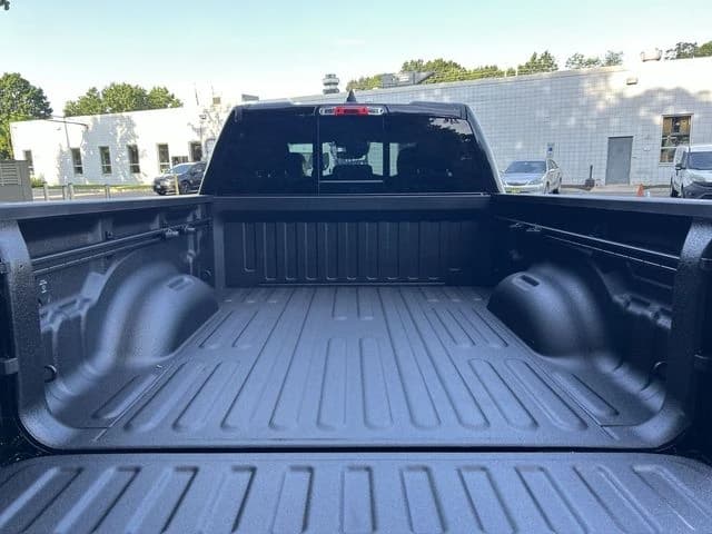 Ram 1500 Big Horn 4x4 Quad Cab 6'4" Box 2026 — side view