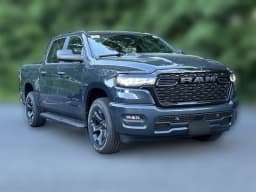 Ram 1500 Express 4x4 Crew Cab 5'7" Box 2026 — side view
