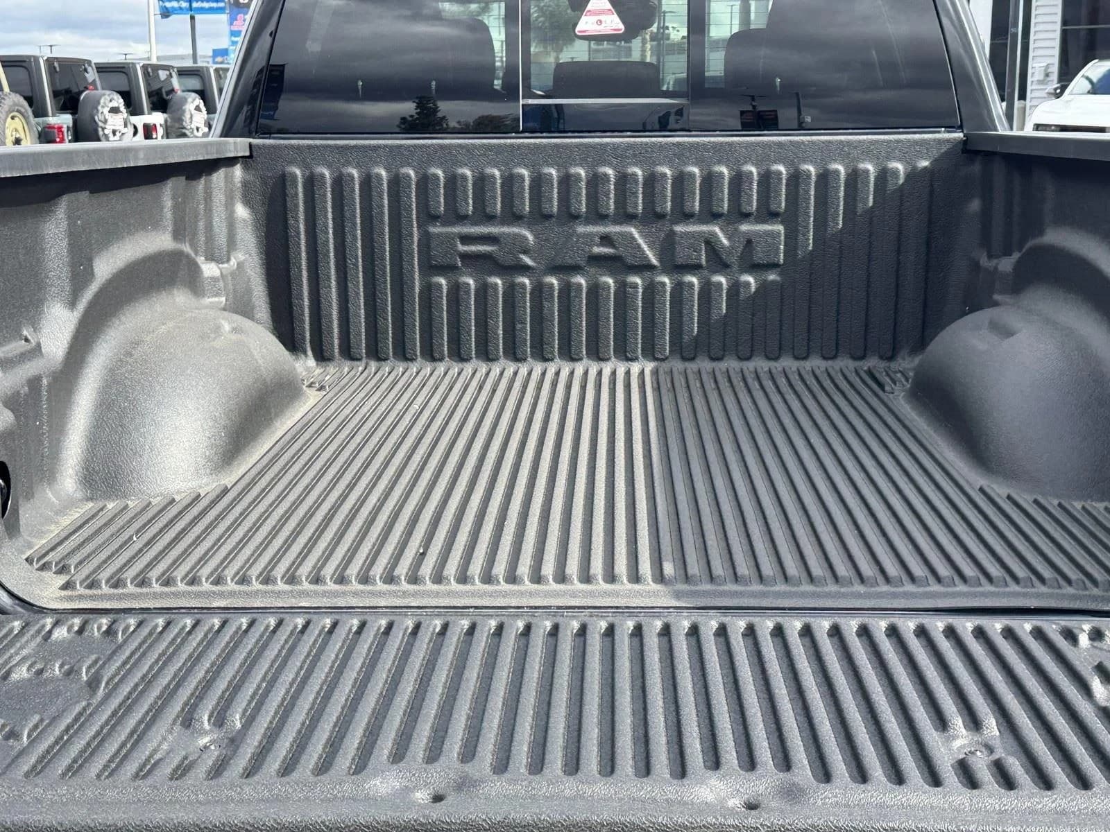 Ram 1500 Laramie 4x4 Crew Cab 5'7" Box 2026 — side view