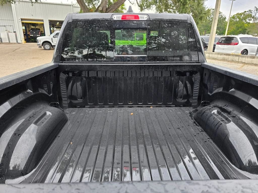 Ram 1500 Laramie 4x4 Crew Cab 5'7" Box 2026 — side view