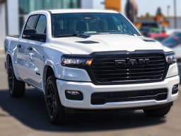 Ram 1500 Laramie 4x4 Crew Cab 5'7" Box 2026 — side view
