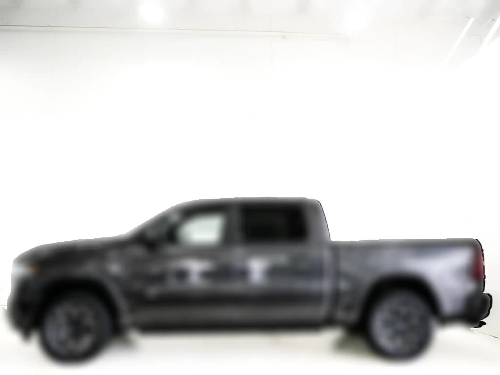 Ram 1500 Laramie 4x4 Crew Cab 5'7" Box 2027 — side view