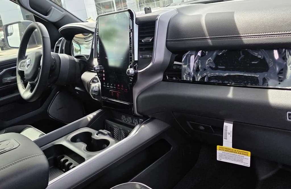 Ram 1500 Laramie 4x4 Crew Cab 5'7" Box 2026 — side view