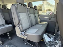Ford Transit Passenger Wagon XLT T-350 HD 148" EL High Roof DRW AWD 2026 — side view
