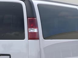 Chevrolet Express Passenger LT RWD 3500 155" 2026 — side view
