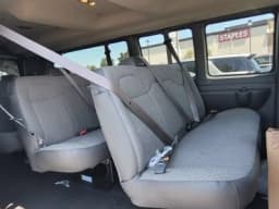Chevrolet Express Passenger LT RWD 3500 155" 2026 — side view