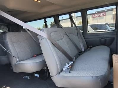 Chevrolet Express Passenger LT RWD 3500 155" 2026 — side view