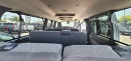 Chevrolet Express Passenger LT RWD 3500 155" 2026 — side view