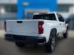 Chevrolet Silverado 2500HD Custom 4WD Crew Cab 159" 2026 — side view