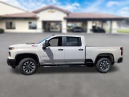 Chevrolet Silverado 2500HD Custom 4WD Crew Cab 159" 2026 — side view