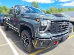 Chevrolet Silverado 2500HD LT 4WD Crew Cab 159" 2026 — side view
