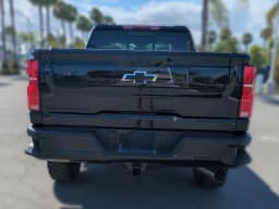 Chevrolet Silverado 2500HD LT 4WD Crew Cab 159" 2026 — side view