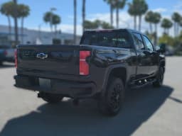 Chevrolet Silverado 2500HD LT 4WD Crew Cab 159" 2026 — side view