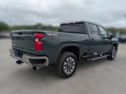 Chevrolet Silverado 2500HD LT 4WD Crew Cab 159" 2026 — side view
