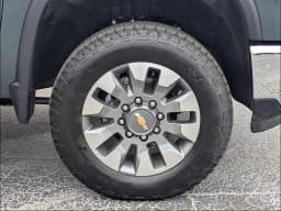 Chevrolet Silverado 2500HD LT 4WD Crew Cab 159" 2026 — side view