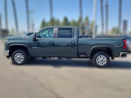 Chevrolet Silverado 2500HD LT 4WD Crew Cab 159" 2026 — side view