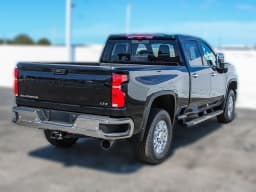 Chevrolet Silverado 2500HD LTZ 4WD Crew Cab 159" 2026 — side view