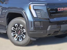 GMC Sierra EV Standard Range Elevation e4WD Crew Cab 2026 — side view