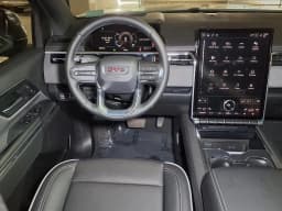 GMC Sierra EV Standard Range Elevation e4WD Crew Cab 2026 — side view