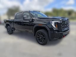 GMC Sierra 2500HD AT4 4WD Crew Cab 159" 2026 — side view