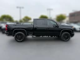 Chevrolet Silverado 2500HD Custom 4WD Crew Cab 159" 2026 — side view