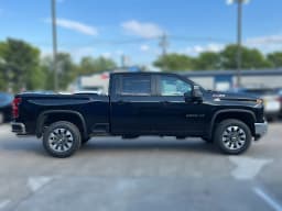 Chevrolet Silverado 2500HD LT 4WD Crew Cab 159" 2026 — side view