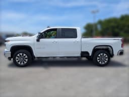 Chevrolet Silverado 2500HD LT 4WD Crew Cab 159" 2026 — side view