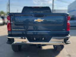 Chevrolet Silverado 2500HD LT 4WD Crew Cab 159" 2026 — side view
