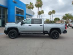Chevrolet Silverado 2500HD LT 4WD Crew Cab 159" 2026 — side view