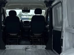 Ram ProMaster Cargo Van Tradesman 1500 Low Roof 136" WB w/Pass Seat 2026 — side view
