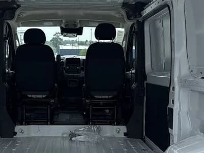 Ram ProMaster Cargo Van Tradesman 1500 Low Roof 136" WB w/Pass Seat 2026 — side view