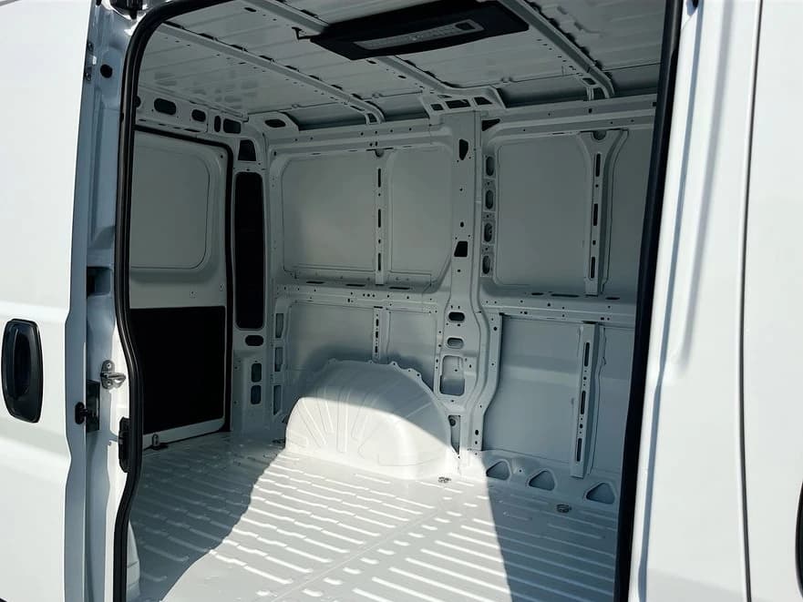 Ram ProMaster Cargo Van Tradesman 1500 Low Roof 118" WB w/Pass Seat 2026 — side view