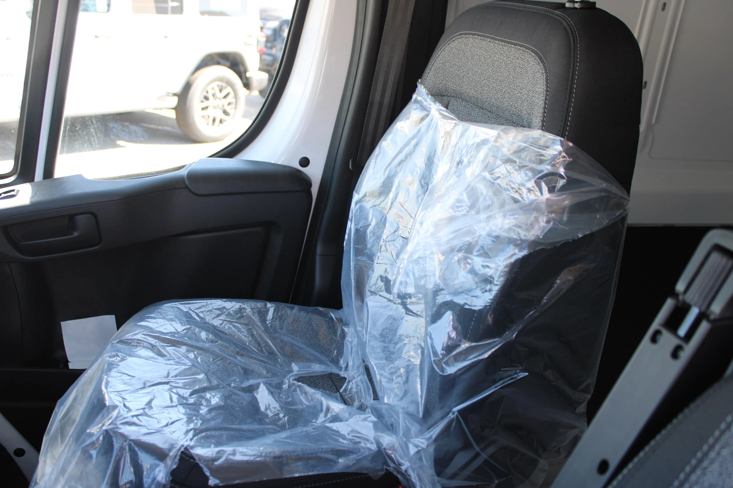 Ram ProMaster Cargo Van Tradesman 1500 Low Roof 118" WB w/Pass Seat 2026 — side view