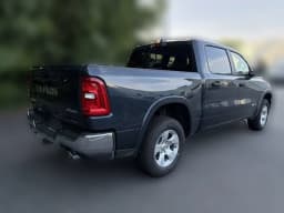 Ram 1500 Big Horn 4x4 Crew Cab 5'7" Box 2026 — side view