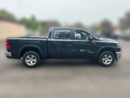 Ram 1500 Big Horn 4x4 Crew Cab 5'7" Box 2026 — side view