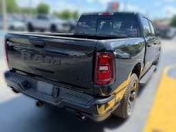 Ram 1500 Express 4x4 Crew Cab 5'7" Box 2026 — side view