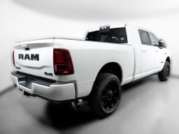 Ram 2500 Laramie 4x4 Mega Cab 6'4" Box 2027 — side view