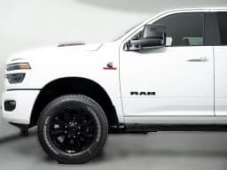 Ram 2500 Laramie 4x4 Mega Cab 6'4" Box 2027 — side view