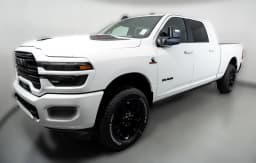 Ram 2500 Laramie 4x4 Mega Cab 6'4" Box 2027 — side view